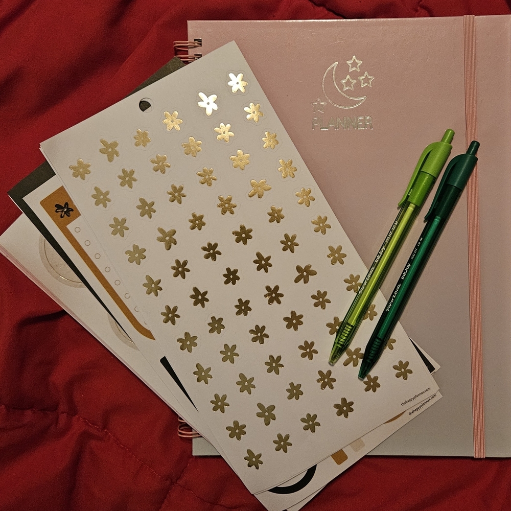 Pink Planner with Stickers and Green Pens